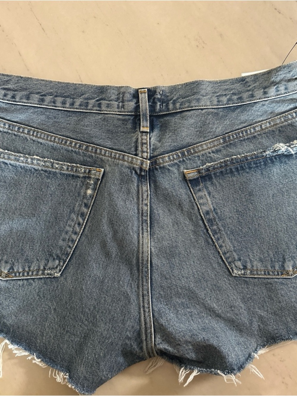 Agolde Light Blue Distressed Denim Cutoff Shorts